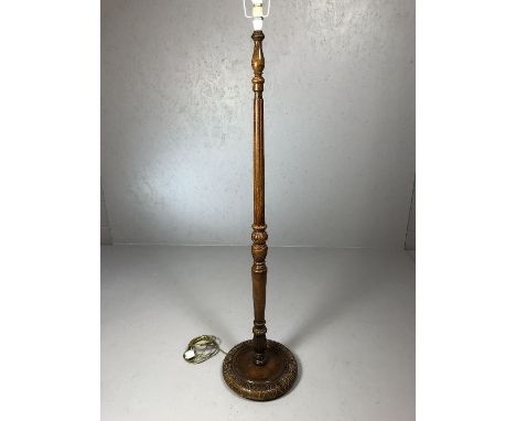 Carved wooden standard lamp