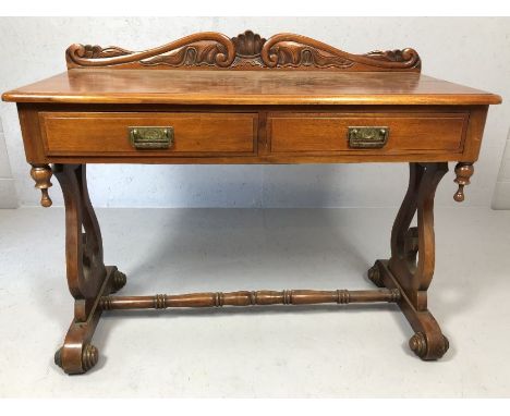 Two drawer console or hall table with carved upstand, turned stretcher and scroll feet, approx 110cm x 50cm x 89cm tall