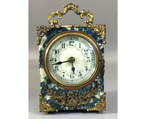 Small Bakelite marble effect carriage clock with gold gilt detailing and white circular face winds and runs 
