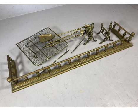 Georgian brass fender and a collection of brass fireside tools