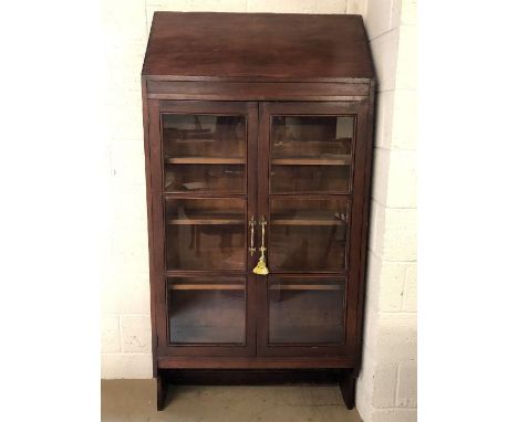 Glass-fronted book shelf with adjustable shelves, two doors and original key, approx 94cm x 30cm x 186cm tall