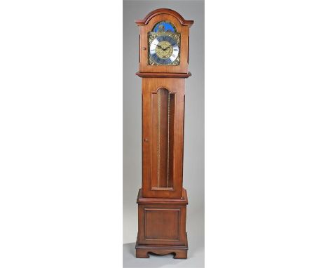 Billib longcase clock, the hood case above a long glazed trunk door, plank base, the moon phase dial with silvered chapter ri