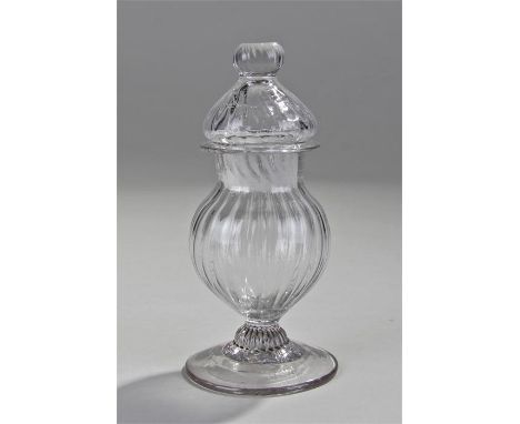 18th Century wrythen glass lidded mustard pot, the finial top above a wrythen top and bulbous body, platform footed base, 14c