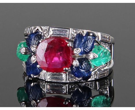 Cartier ruby, diamond, sapphire and emerald Tutti-Frutti ring, the central 2.12 carat ruby, flanked by leaf carved sapphires 