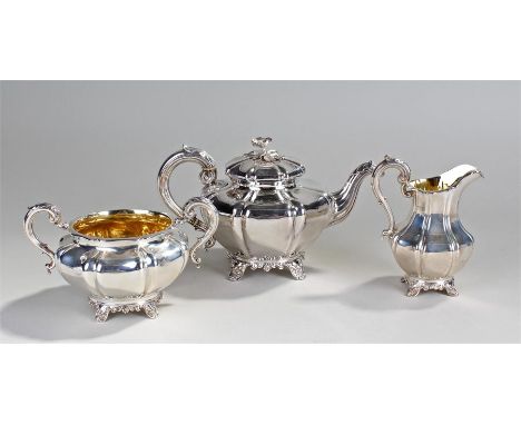 Victorian silver three piece tea set, London, 1850, maker Charles Thomas Fox and George Fox, the teapot with a foliate modell