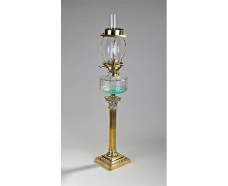 Victorian brass oil lamp, the chimney with brass frame above a clear glass font and Corinthian column, stepped base, 83cm hig