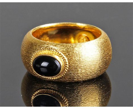 Yellow metal ring, made in Saudi Arabia, black central stone with ethced effect shank, 7 grams, ring size M