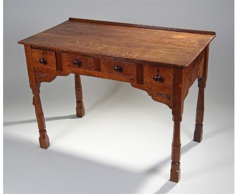 1930's Robert ``Mouseman`` Thompson oak dressing table, the overhanging top with tail carved corners, above a series of four 