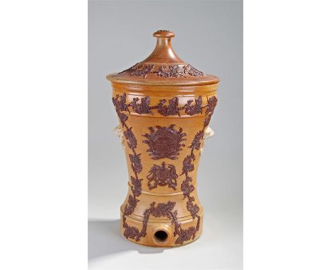 Victorian Lipscomb stoneware water filter, the finial top above a shaped body applied with grape and leaf design, central pla
