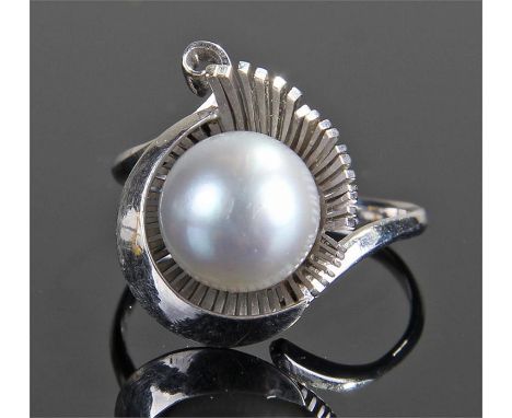 14 carat gold and black pearl set ring, the central approximately 10mm wide pearl raised above a scrolling mount, ring size U