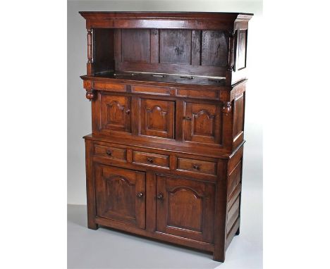 18th Century and later oak tridarn, the tridarn top above fielded panel doors, the centre with enclosed secret drawer, rectan