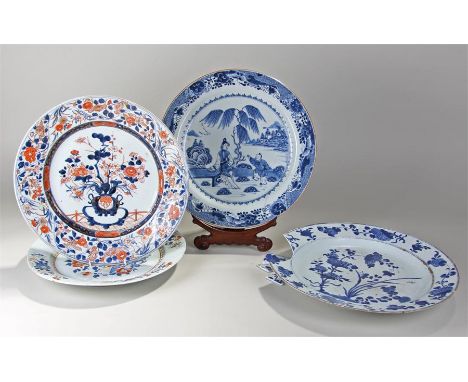 Four 19th Century Oriental chargers, an Imari example, an enamel example and two blue and white painted examples, together wi