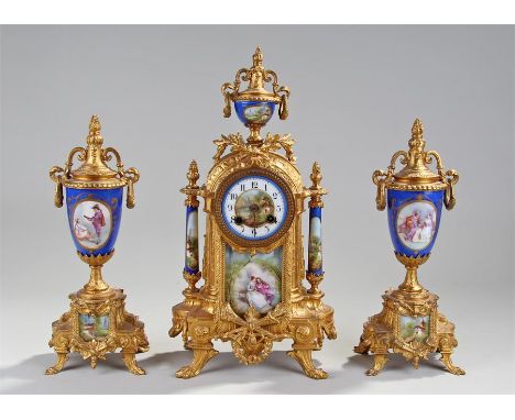 Late 19th Century French gilt metal clock garniture, the clock surmounted with a porcelain urn finial above an acanthus leaf 