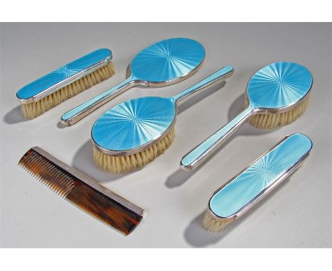 George V silver and blue guilloché enamel dressing table set, London, 1935, Mappin and Webb, to include the mirror, four brus