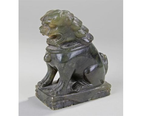 Chinese jade lion, in a seated position with collar, raised on a plinth base with carved boarder, 13cm high, 10.5cm long
