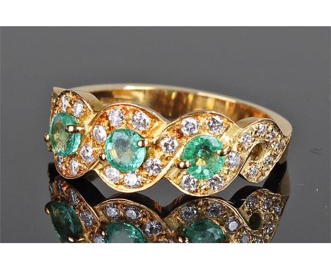 18 carat gold diamond and zircon ring, with three blue/green stones, surrounded with diamonds, ring size O