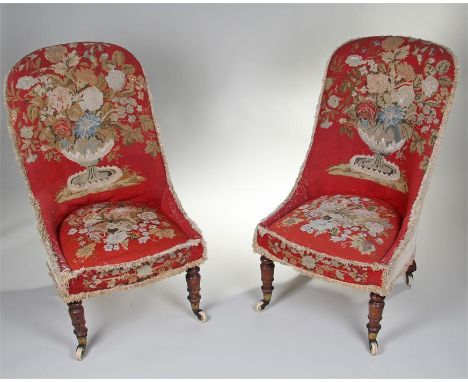 Pair of Victorian nursing chairs, with arched top rails and stuff over seats, raised on turned legs and ceramic castors, both