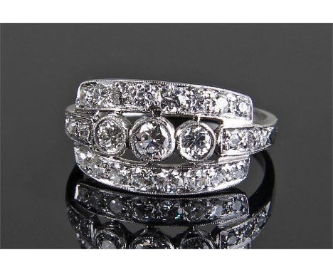 18 carat white gold diamond set ring, with three bands of diamonds set to the top, an estimated total carat weight of 1.1 car