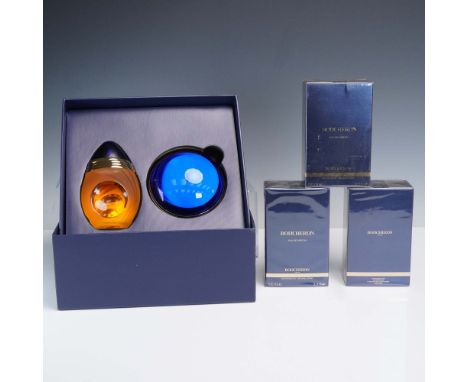 Includes three boxed bottles of Boucheron Eau de Parfum, each in sealed packaging. Two are presented in an elegant deep blue 