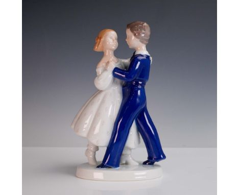 This graceful porcelain figurine by Bing &amp; Grondahl of Denmark captures a young couple mid-dance, rendered in a glossy wh