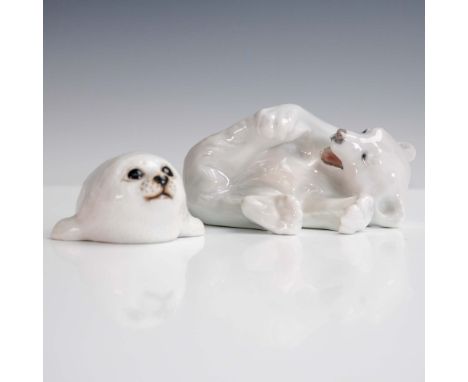 This charming 2-piece porcelain set features an adorable reclining polar bear figurine by Royal Copenhagen, marked with model