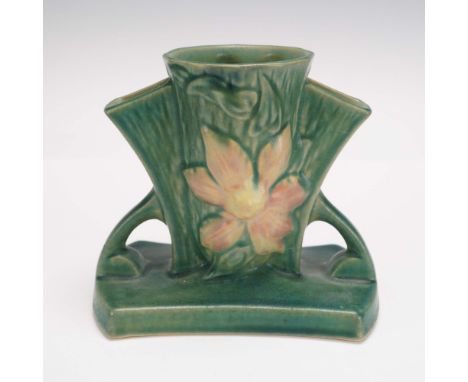 This beautiful Roseville Pottery Clematis double bud vase, circa 1940s, showcases the brand's signature craftsmanship in an e