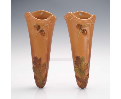 Offered is a delightful pair of Weller Pottery wall pockets in the Oak Leaves pattern. Each piece features a warm matte brown