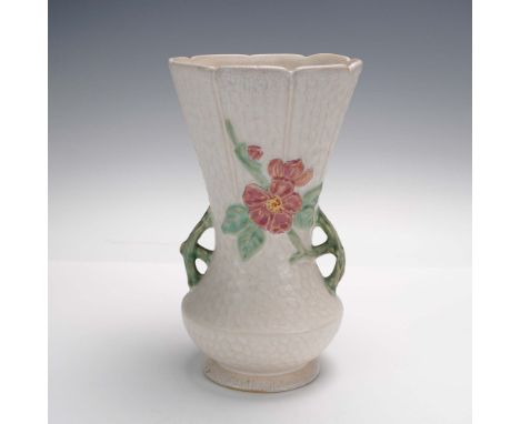 This Weller Pottery Delsa vase features a tall, flared form with pierced side handles and a distinctive relief floral motif i