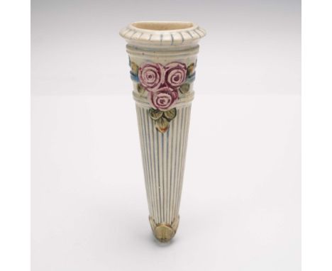 This early 20th-century wall pocket by Weller Pottery features an elegant tapered form with vertical ribbing and a flared rim