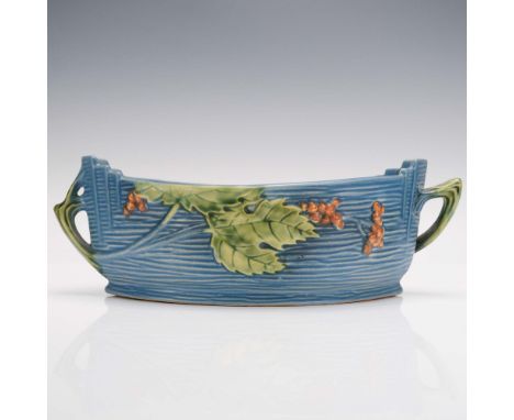 This Roseville Pottery console bowl in the Bushberry pattern features a rich blue textured background adorned with raised gre
