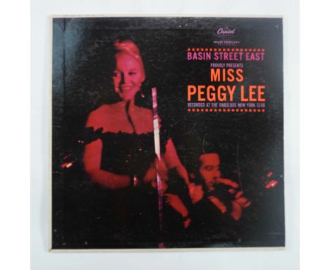 This vintage vinyl LP, Basin Street East Proudly Presents Miss Peggy Lee, was released by Capitol Records (T-1520) and captur