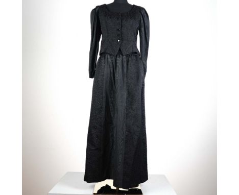 Striking and sophisticated, this vintage 2-piece Saint Laurent Rive Gauche ensemble in size 38 exemplifies the timeless elega