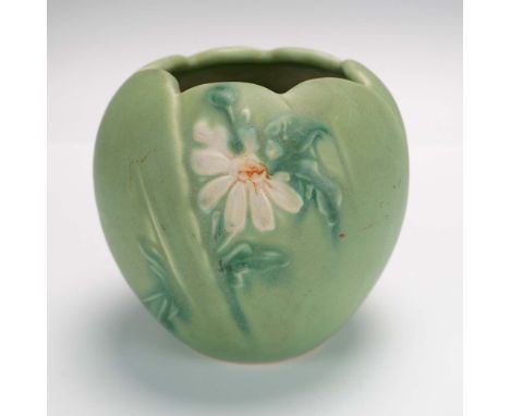 This lovely Weller Pottery vase from the 1930s features the charming Daisy pattern in a soft matte green glaze. The vase is b