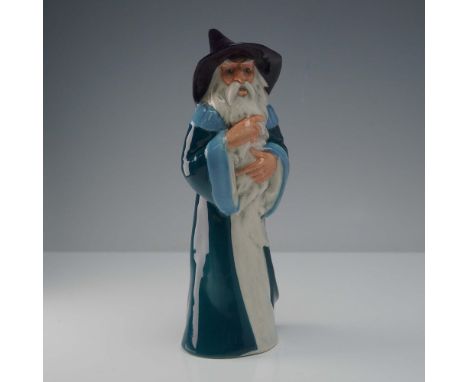 This Royal Doulton porcelain figurine depicts Gandalf the Grey, the iconic wizard from J.R.R. Tolkien's The Lord of the Rings