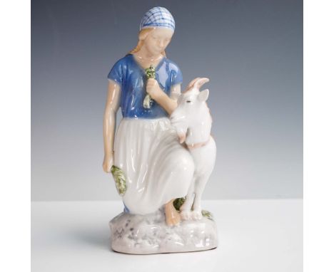 A charming porcelain figurine by Bing and Grondahl of Denmark, depicting a young girl seated with a gentle goat by her side. 