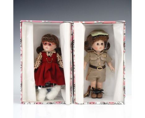 Pair of 8-inch collectible dolls from the Vogue Dolls Ginny series, both presented in their original illustrated boxes. Inclu