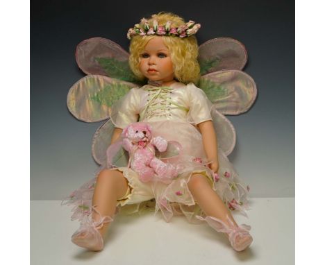This limited edition porcelain doll, titled Jenny, hails from The Palmary Collection by Three Hearts, Inc. Designed by artisa