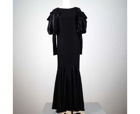 An elegant black evening gown by British designer Shirley Parker, showcasing refined mid-century glamour. This full-length dr
