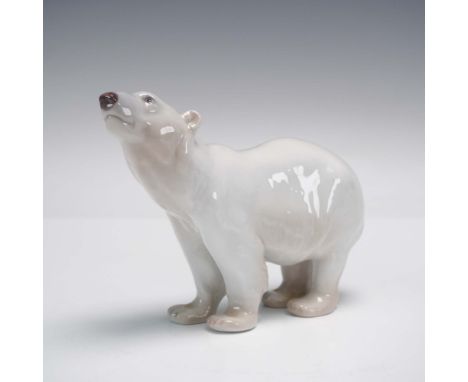 Bing &amp; Grondahl porcelain figurine features a polar bear standing alert with its head raised. Finished in a glossy white 