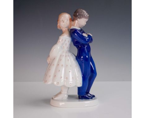 This charming porcelain figurine by Bing &amp; Grondahl of Denmark depicts a young girl and boy standing back-to-back in a te