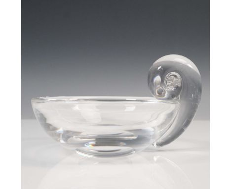 A clear, round bowl featuring a distinctive applied snail-form handle. The bowl is crafted with smooth, rounded walls and a f