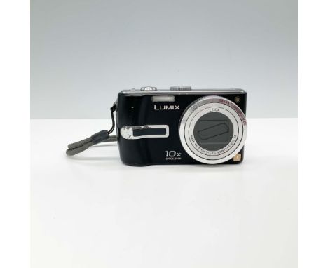 This Panasonic Lumix DMC-TZ3 is a compact digital camera known for its versatility, featuring a 10x optical zoom lens by Leic