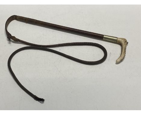 A antique horn handled leather whip