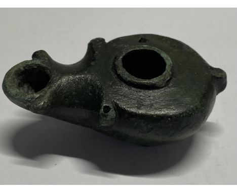 A Roman 2nd/3rd century small bronze oil lamp.