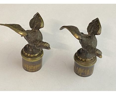 A pair of unusual bronze bird figurines