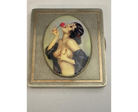 A hallmarked for Birmingham 1940 silver cigarette case with a miniature Art Deco period nude Lady applied to the front. weigh