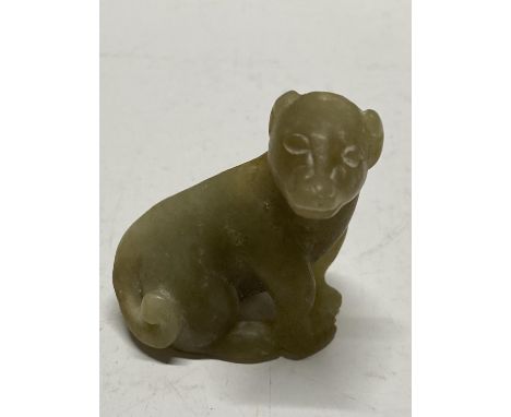 A antique Chinese carved jade dog figurine. 5cm tall.