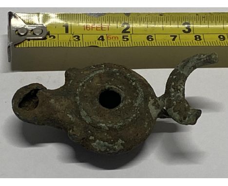 A Roman 2nd/3rd century bull form bronze oil lamp.