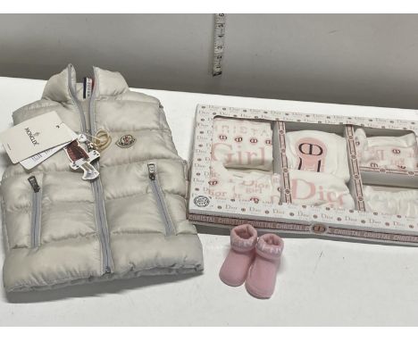 A new with tags child's Moncler gilet with Christian Dior set of baby clothing (unauthenticated)