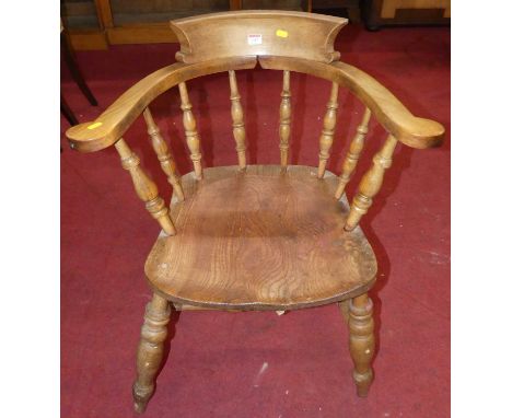 An elm and beech stick back tub captain's chair, width 66cm